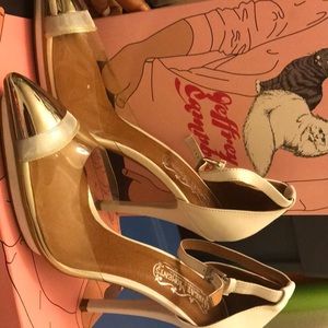 White ankle strap heel with clear accent.